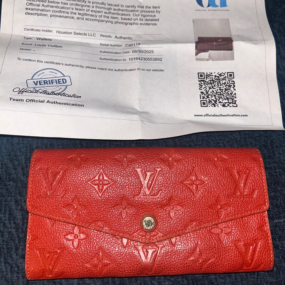 Louis Vuitton Monogram Empreinte “Sarah” Continental Wallet in red.